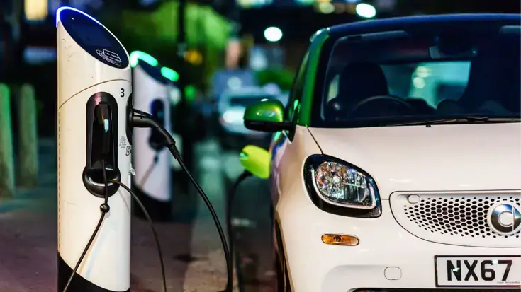 Electric car plugged into EV charging point