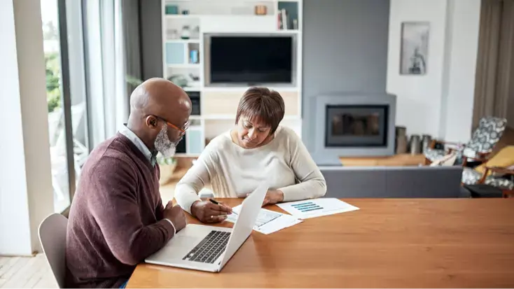 A couple look over documents