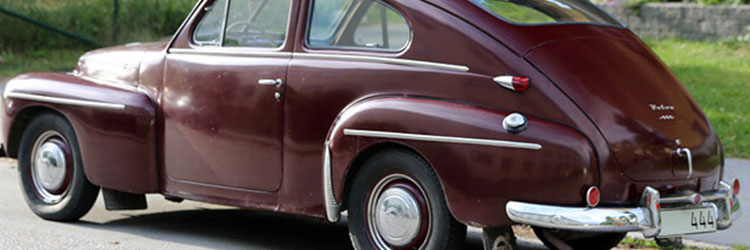 Volvo pv544 parked on the road